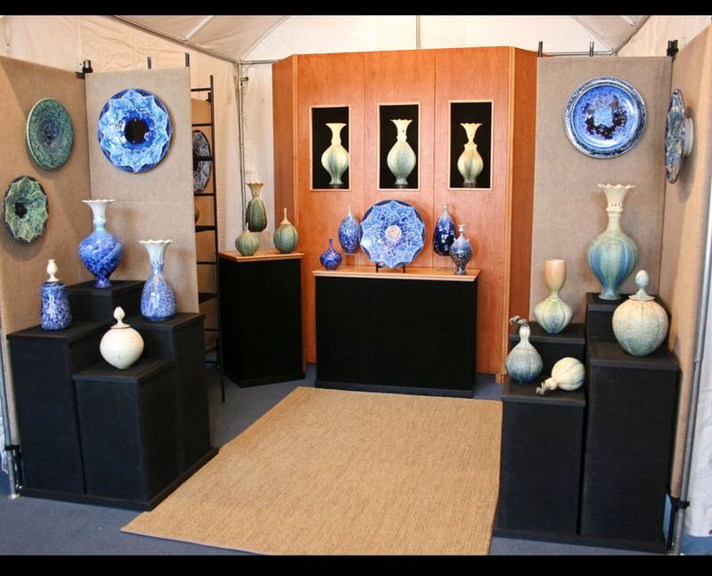 Vases and urns displayed on shelves	